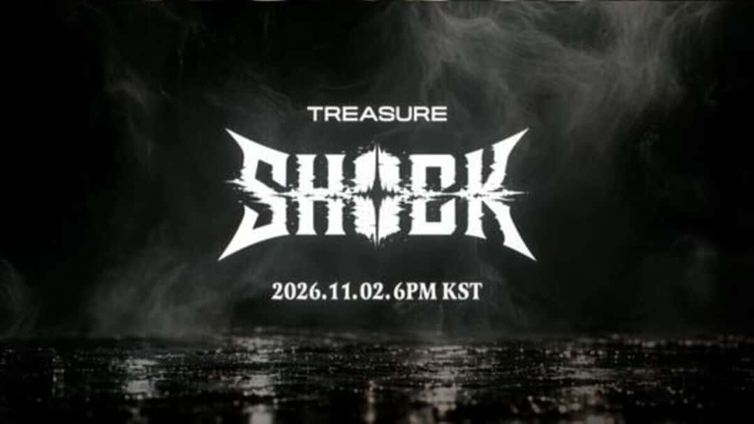 Fotograma del teaser oficial de «SHOCK»: el logo blanco de la canción, con letras filosas, sobre un fondo de humo negro, con la palabra TREASURE arriba y la fecha 2026.11.02 6PM KST abajo